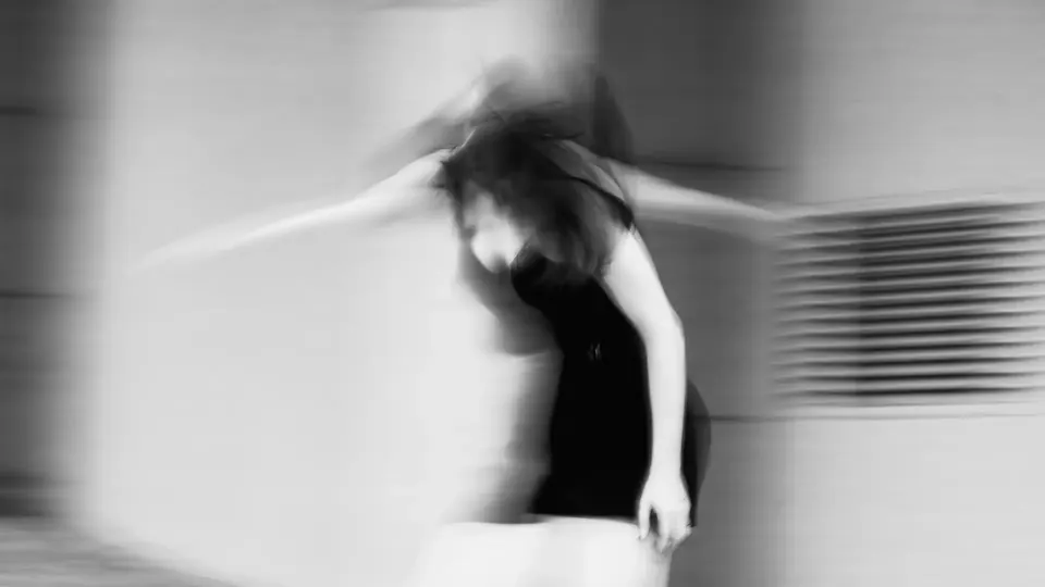 Blurred dancer spinning, black and white
