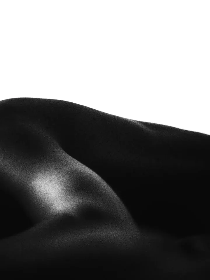 Low-key study of a shoulder and back in black and white